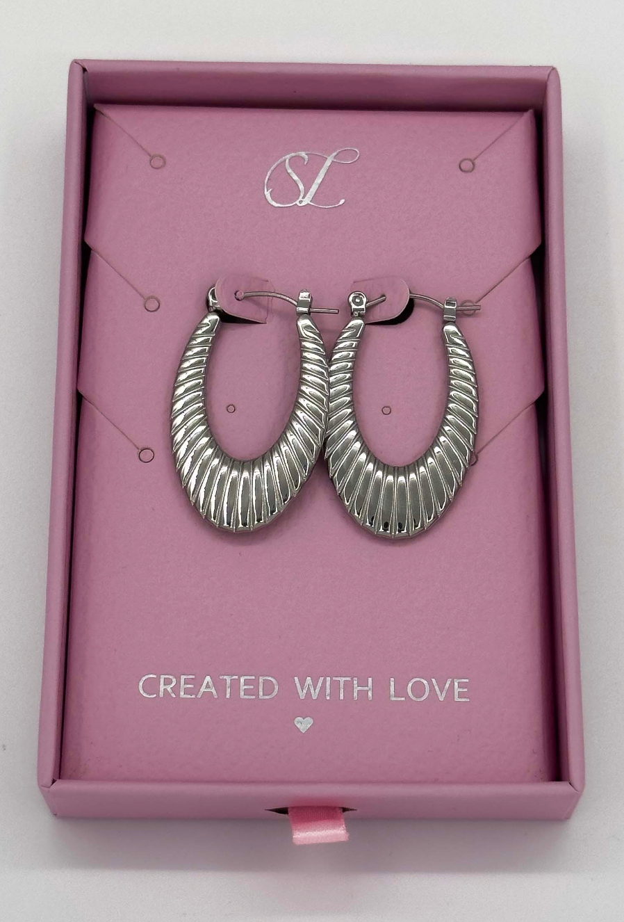 60057 Title: RoestvrijstalEn en Hoepel Oorbellen Met Textuur | Silver