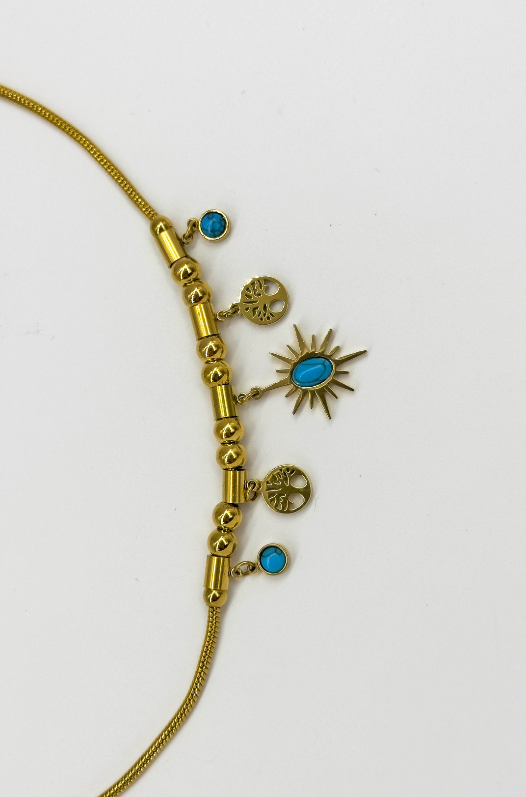 64043 Fijne Roestvrijstalen Ketting Met Bohemian Turquoise Hangers | Gold