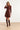 25745 – Smashed Lemon Gebreide jurk met elegante plooival | Brown