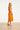 Dames Jurk Met Strikceintuur En Golvende Details | Light Orange - Sand