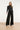 Wijde pantalon met paillettenbies en strikkoord | Black